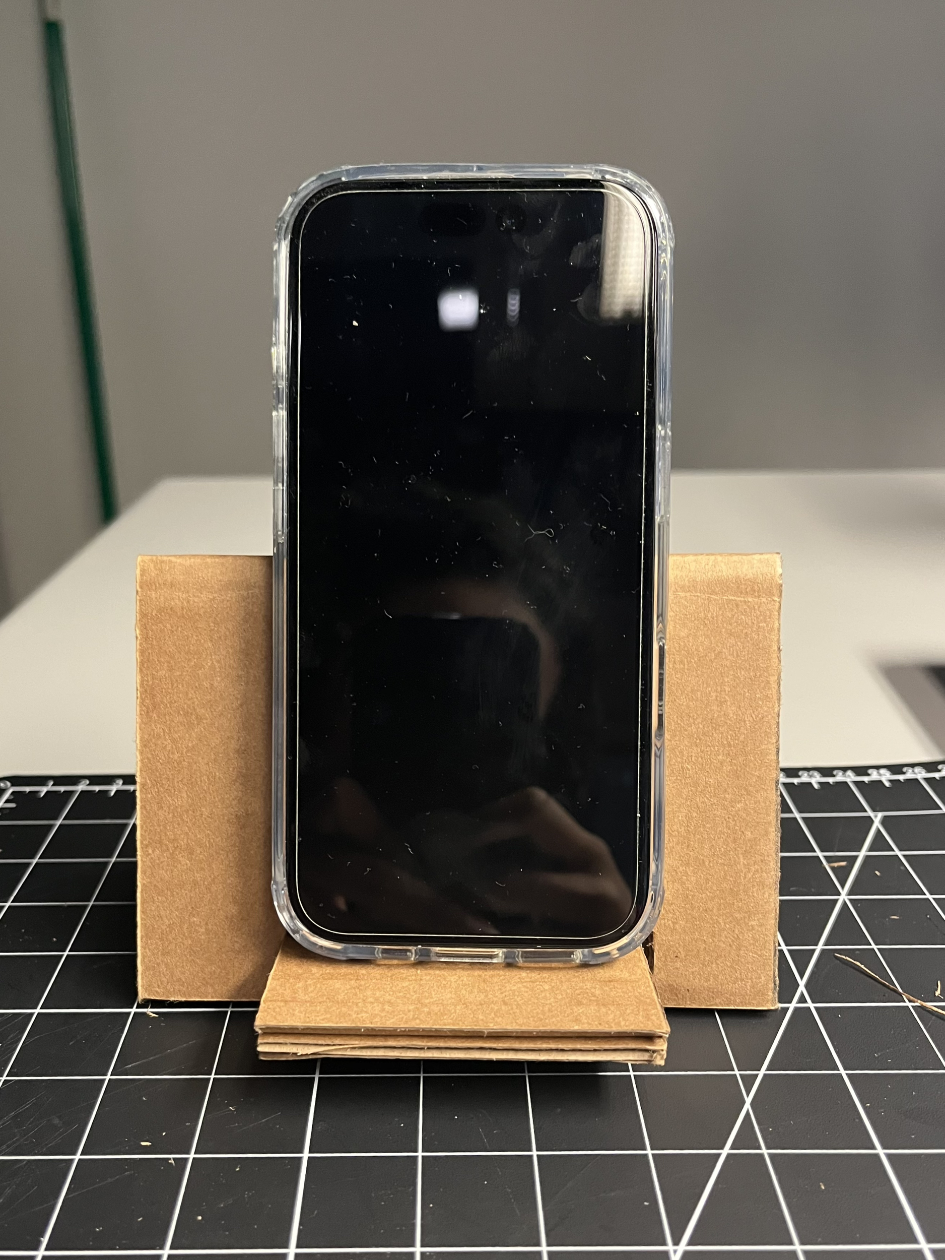 This is what our phone stand looks like when it is holding a phone, so you are able to prop up your phone using this phone stand.